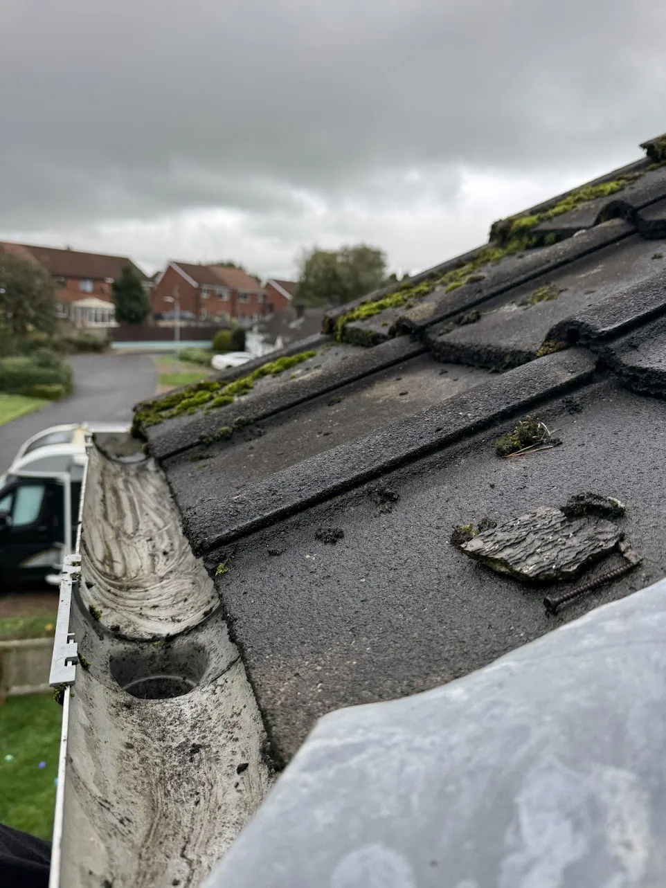 The same gutter cleared out, with the downpipe outlet open again